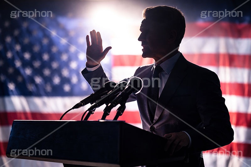 演説,記者会見,会談,スローガン,アピール,マイク,アメリカ,国旗,旗,国際,公約,宣言,発表,政治,首相,首脳,大統領,代表,経済,選挙,政権,速報,支持率,政策,政権交代,外交,人物,男性,男,シルエット,silhouette,hand,government,policies,mic,president,flag,country,america,AI生成素材